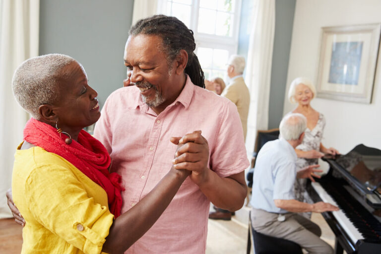 Group Of Seniors Enjoying Dancing Club Together