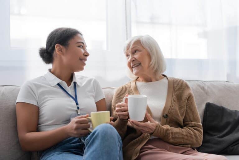 Older woman talking to a caregiver