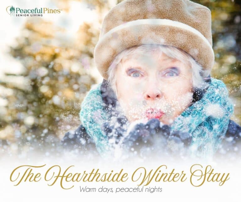 female blowing snow out of her hands