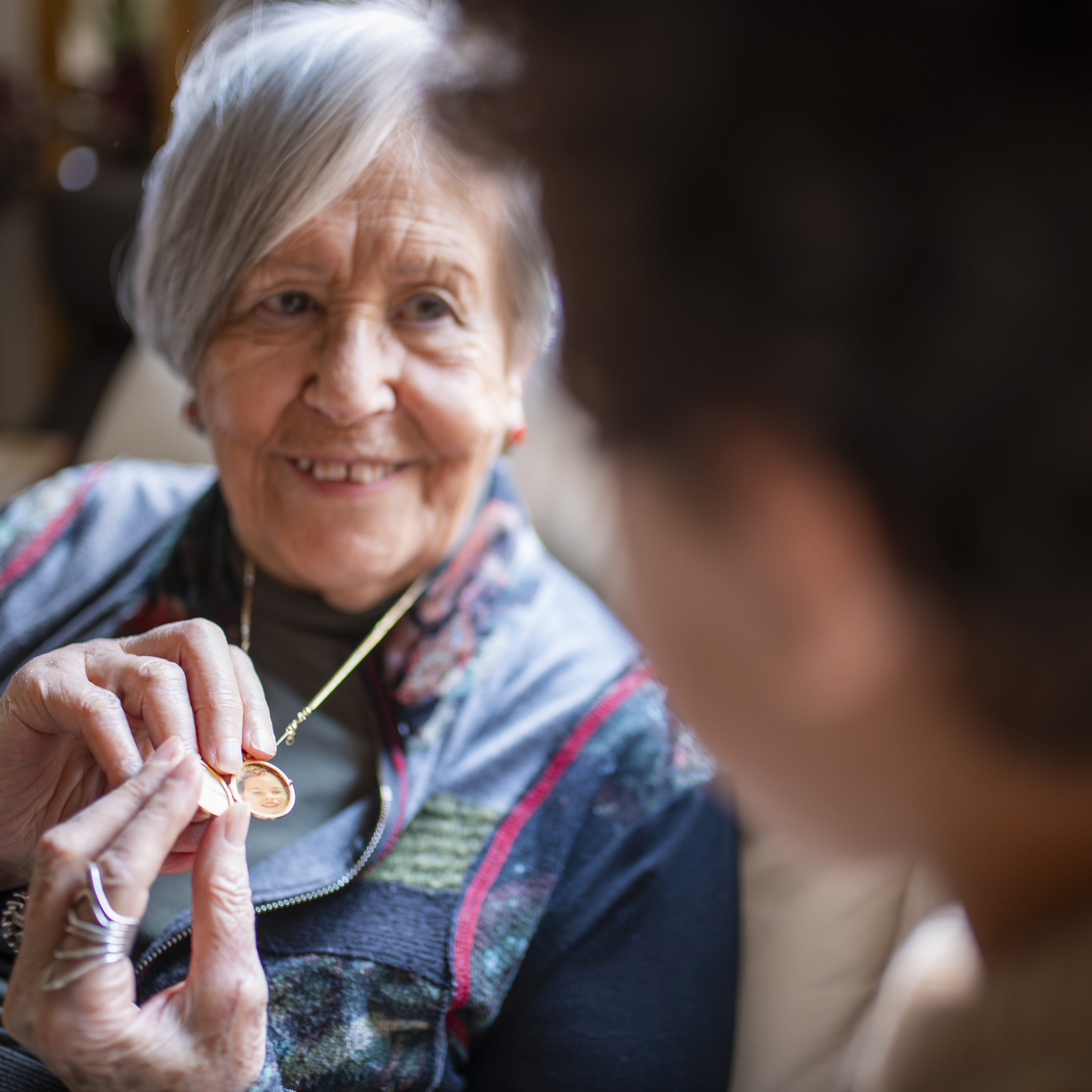 alt="Resident enjoying social activities during a short-term respite stay at Peaceful Pines Senior Living in South Dakota."